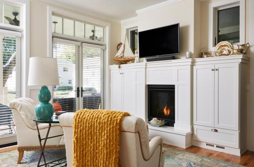 Sun filled living room with extensive built-ins.