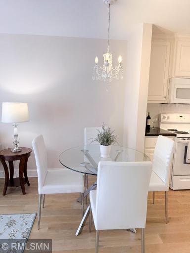 Dining area with cute chandelier lighting!