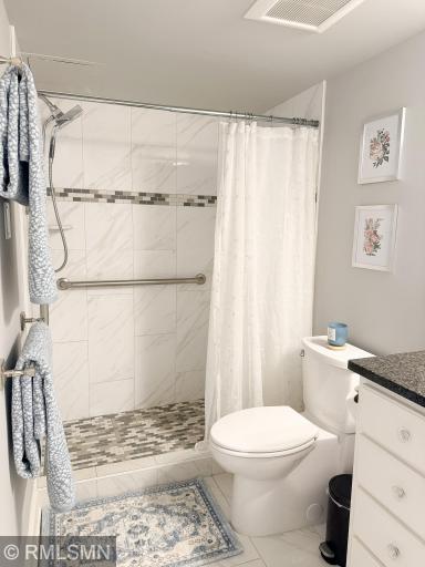 Tiled walls and floor in the shower! Modern and sophisticated!