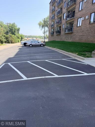Paved parking lot in the back! Unit does not have a garage, but garage spaces are available to rent! Association fee is lower than the units that have garages!