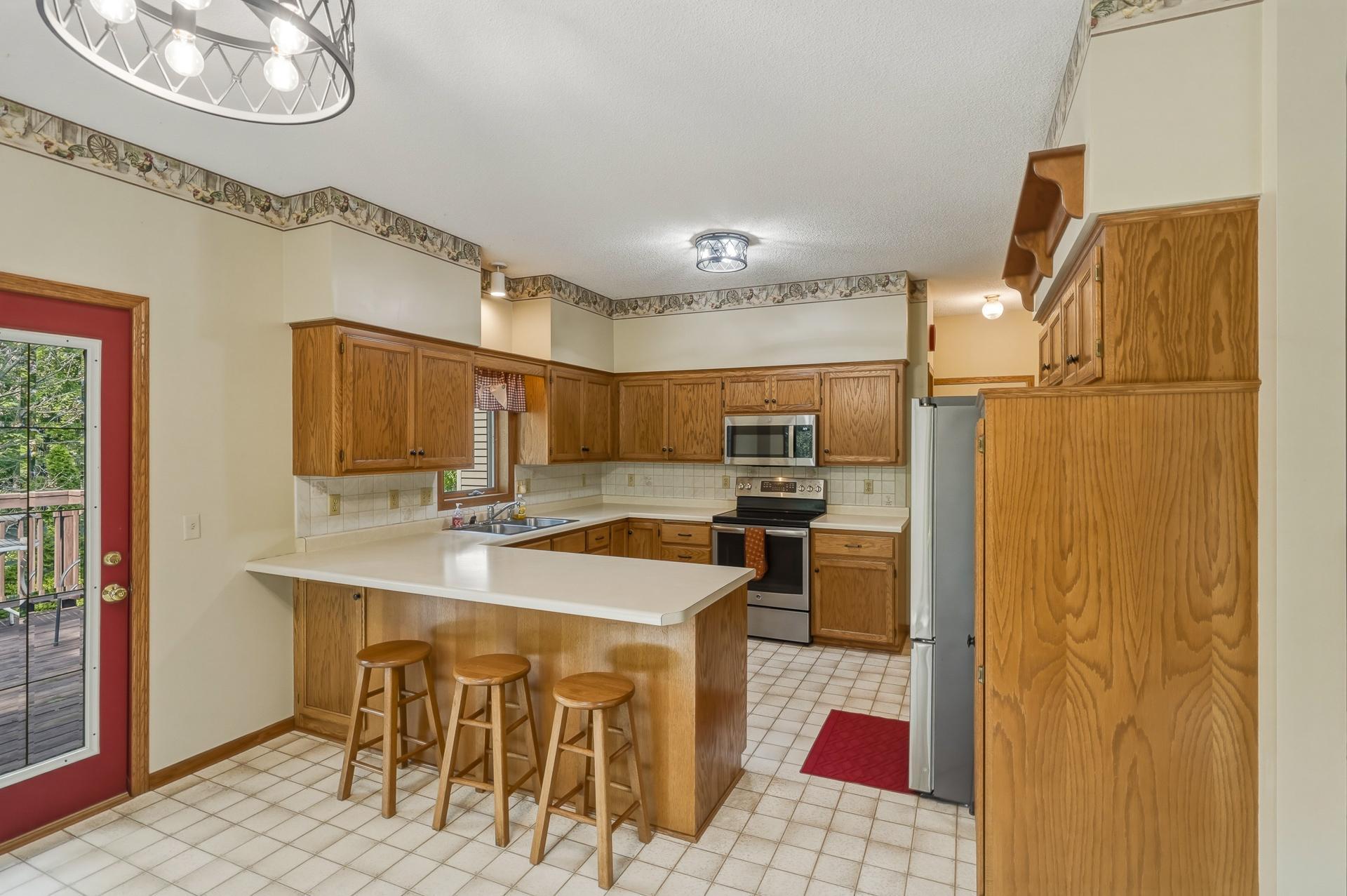 A Convenient Breakfast Bar with Seating- Perfect for Casual Meals, Morning Coffee or Gathering while Entertaining