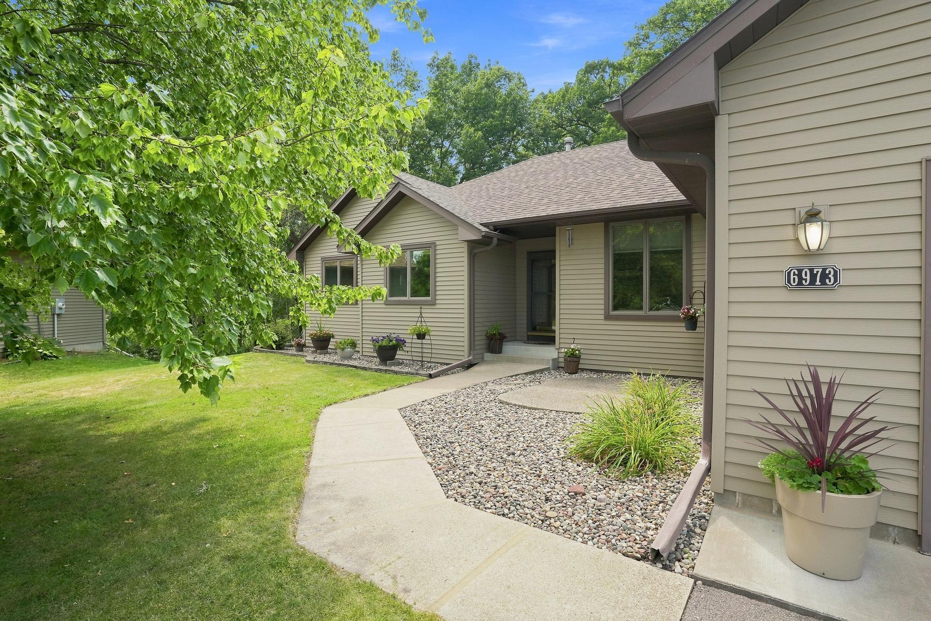 Enjoy the Ease of Main Floor Living with the Added Versatility of a Finished Walk-Out Lower Level- Offering Plenty of Space to Relax, Entertain and Make Your Own!