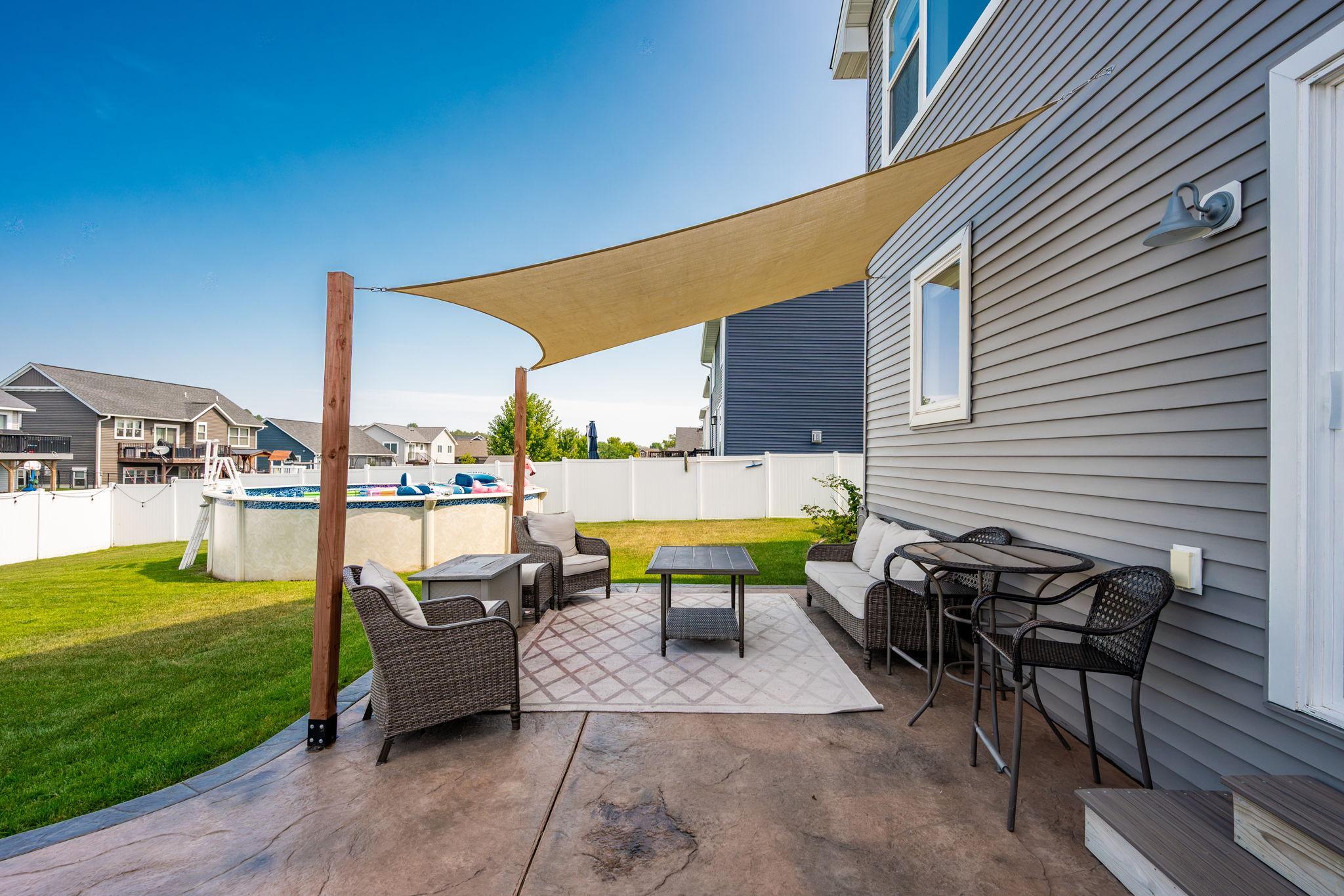 Stunning stamped patio & impressive, fully fenced backyard green space!