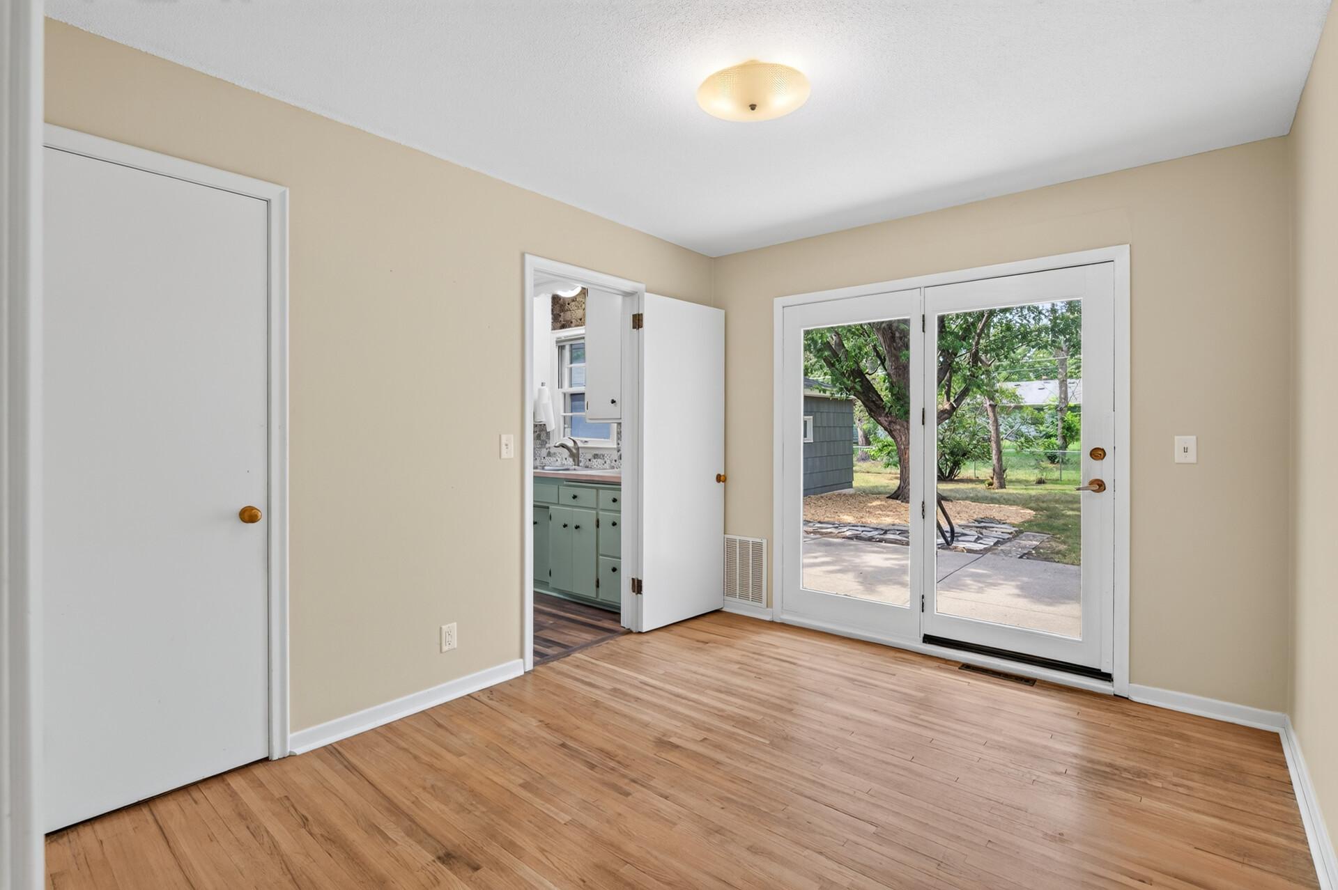 #3 Bedroom/Den also boasts a beautiful French Door to backyard.