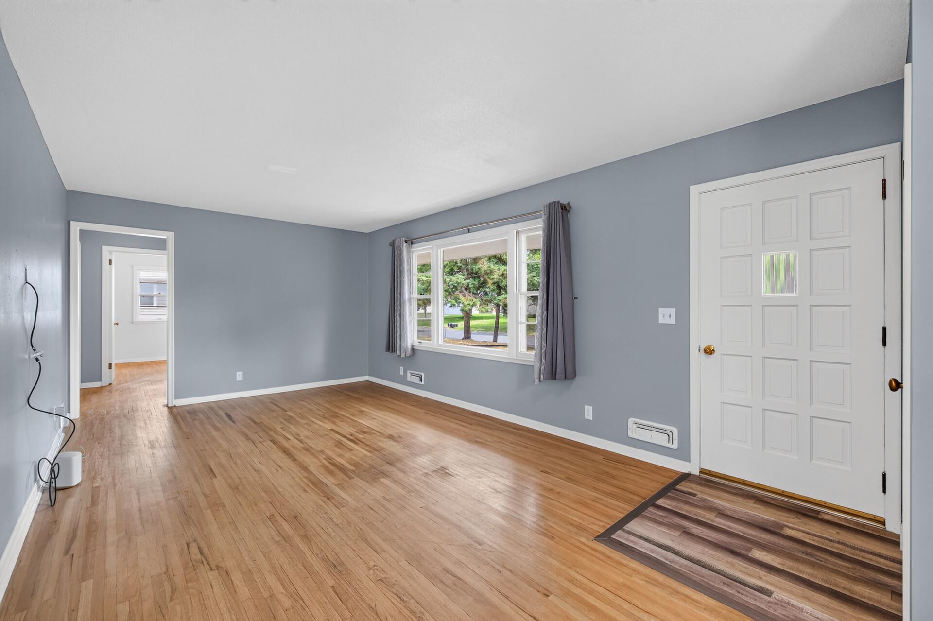 Bright, open Living Room, fresh paint and refinished hardwoods.