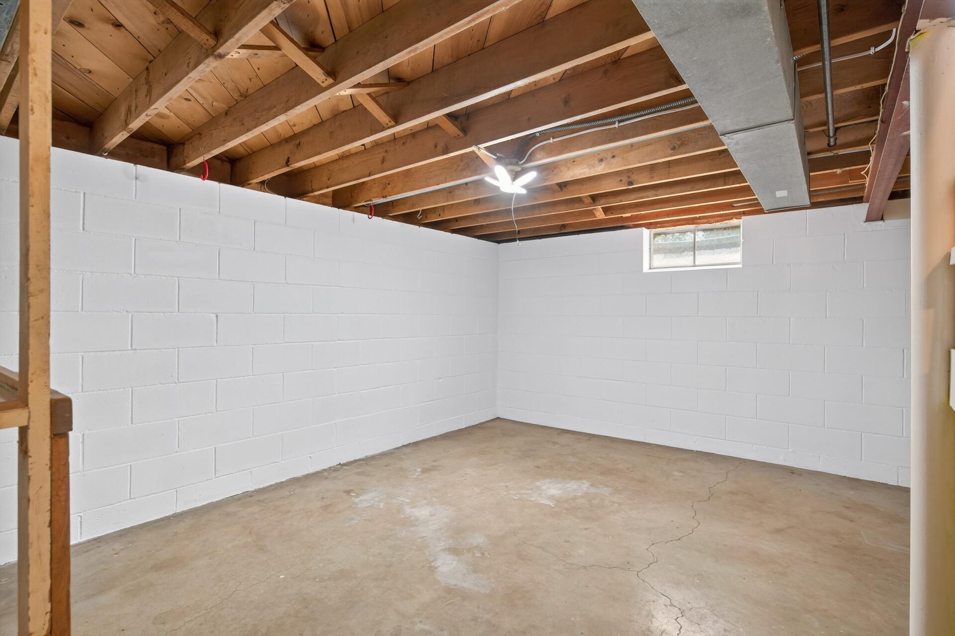 This space in the lower level could easily convert to a 4th bedroom by adding an egress window.