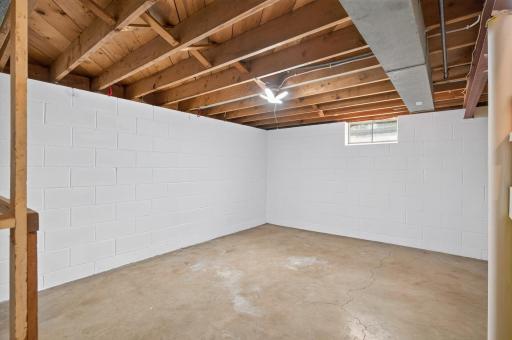 This space in the lower level could easily convert to a 4th bedroom by adding an egress window.