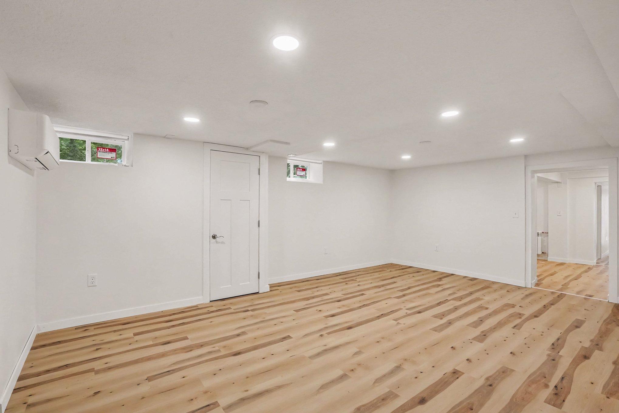 Lower Level Recreational Room 20'x13' with new flooring, ceiling, windows and lighting.