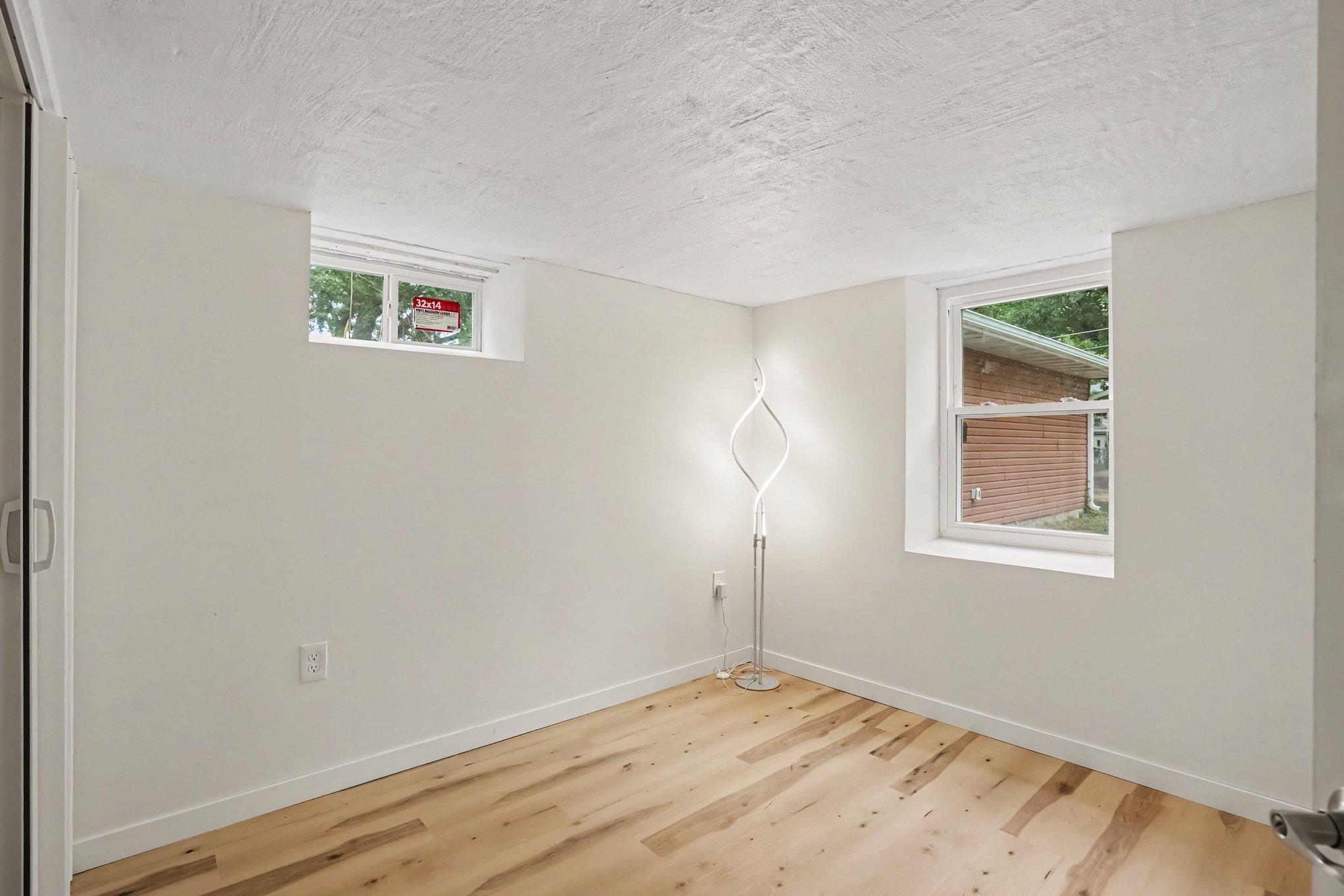 Lower Level Bedroom with new floors, windows and trim.