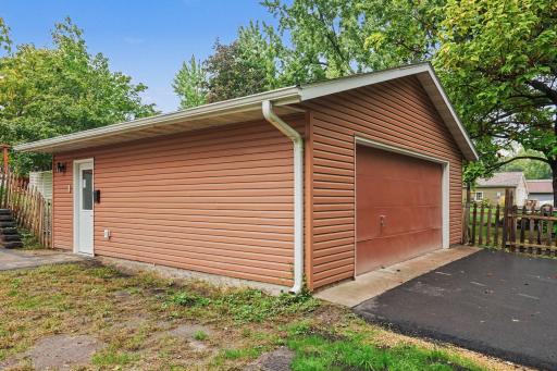 Detached two car garage with new asphalt driveway.
