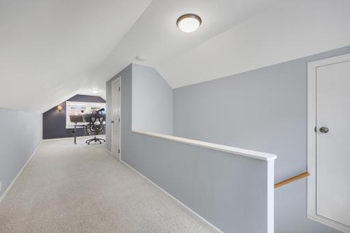 Roomy upper level is perfect for a primary bedroom or additional living space with large walk in closet