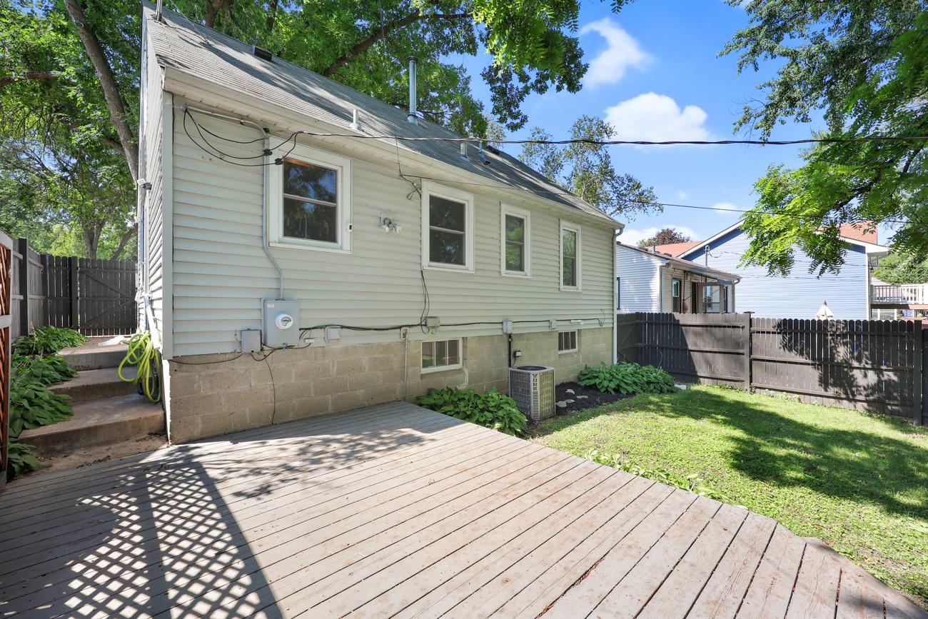 Spacious cedar deck overlooking the fully fenced backyard.