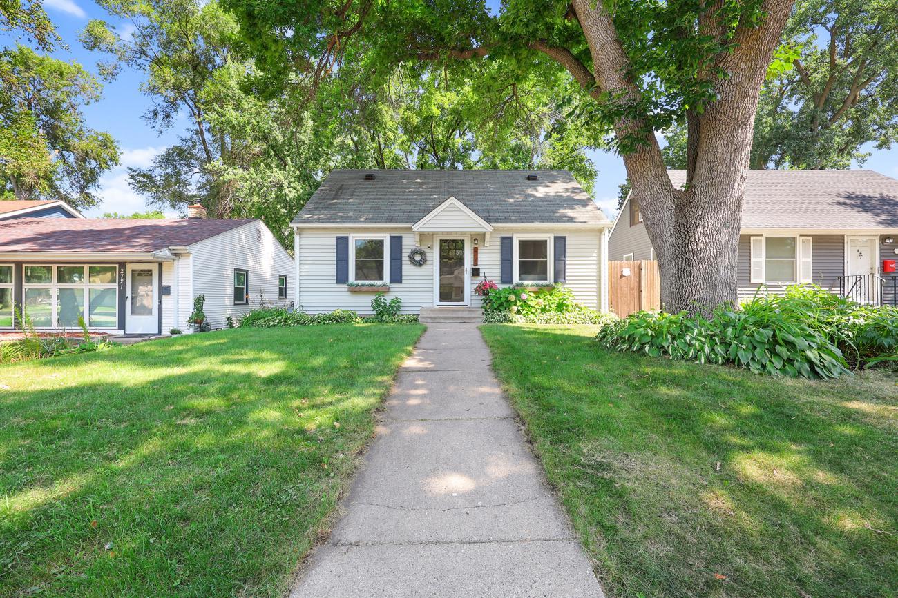 Charming exterior with mature trees and welcoming curb appeal.