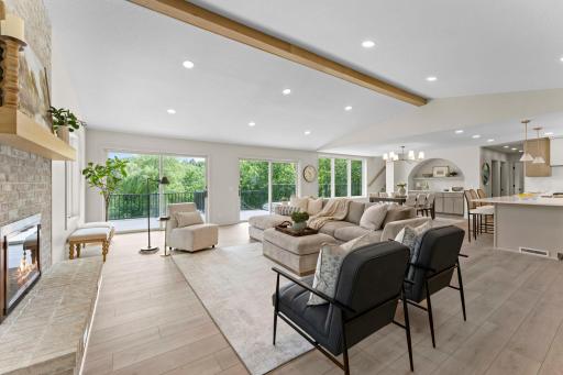 Two sets of sliding glass doors flood the living room with natural light.