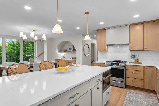 Quartz countertops with full-height backsplash and soft-close cabinetry!