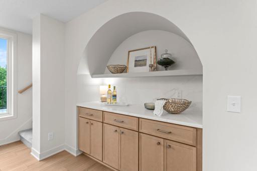 Buffet station with custom arch detailing, providing the perfect space for entertaining, coffee bar, beverage station, or additional serving space.