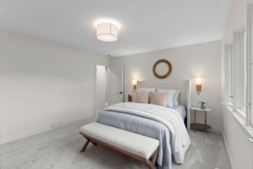 Complete with a spacious walk-in closet featuring custom built-ins.