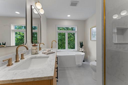 Fully updated, spa-inspired ensuite with dual vanities and a freestanding tub!