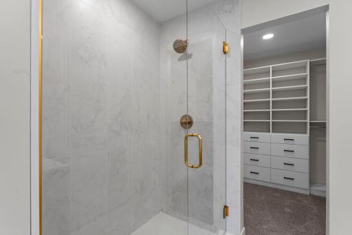 Large walk-in tiled shower.