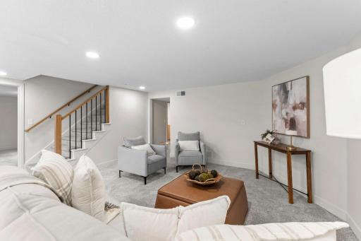 A spacious family room offers the perfect setting for movie nights, game days, or gathering.