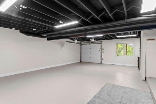 A standout feature of this home is the expansive lower-level flex space, offering an incredible opportunity to create the ultimate recreation and lifestyle area. Complete with built-in cabinetry, workspace areas, and extensive storage potential!