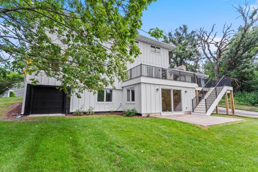 Further enhancing the property's functionality is a separate, insulated, one-stall garage located on the opposite side of the home's rear exterior.