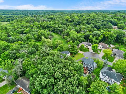 Outside, enjoy the rare luxury of a large, private lot with extensive outdoor living areas!