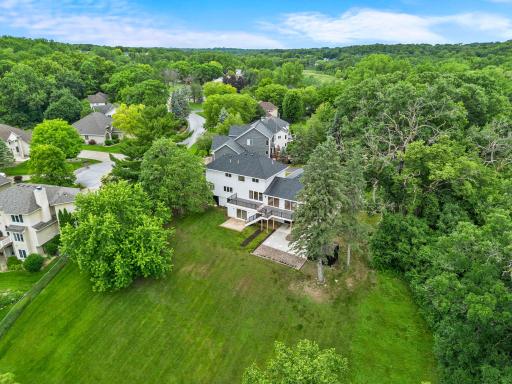 Stunning landscaping and oversized driveway with abundant parking options.