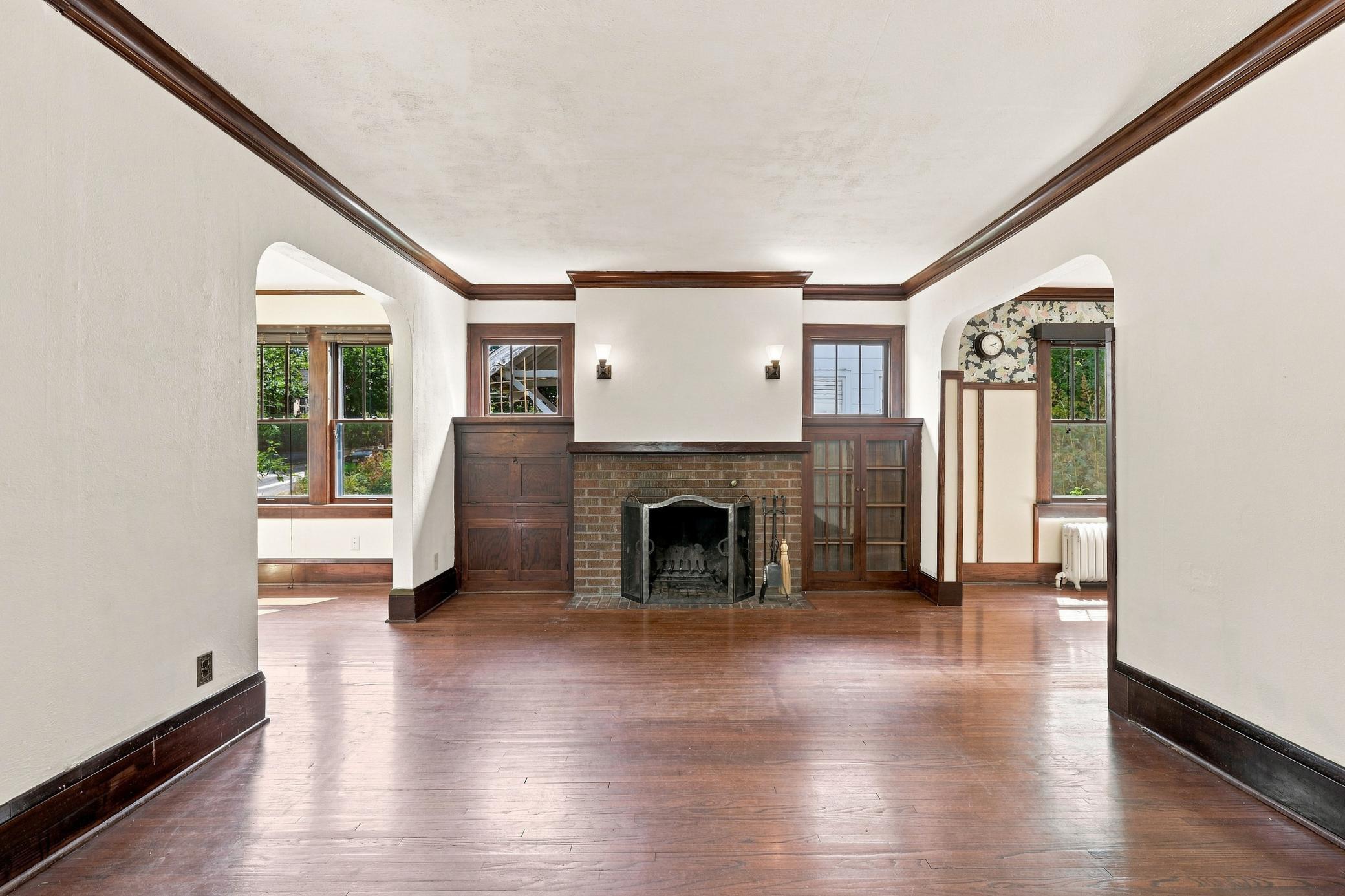 Original Brick Fireplace framed by book cases