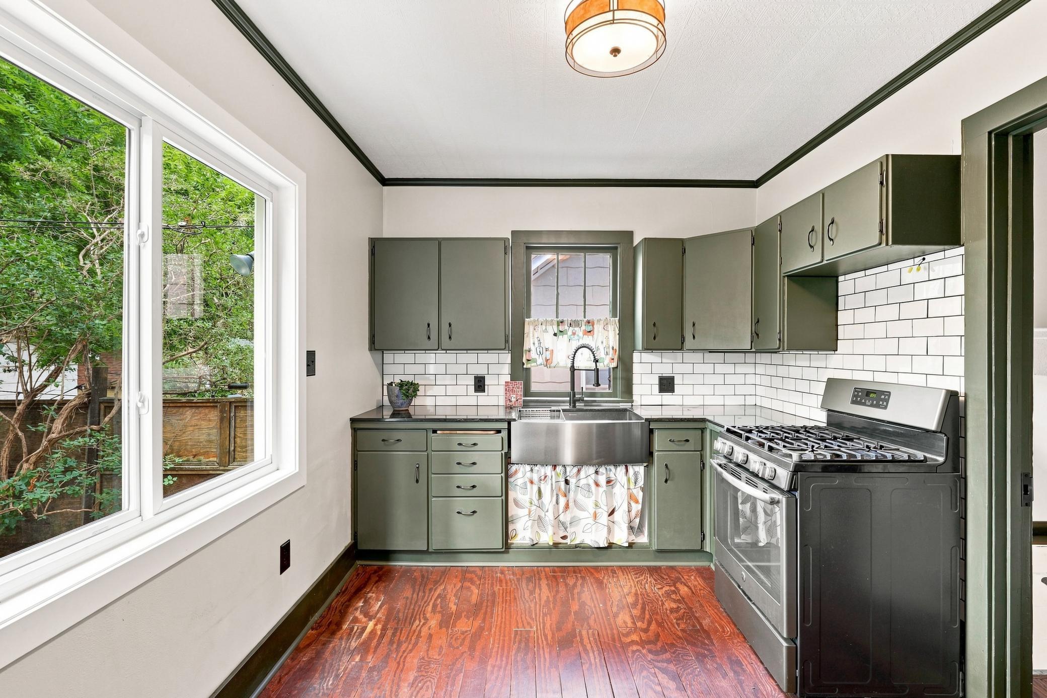 Updated kitchen with Stainless steel farm style sink
