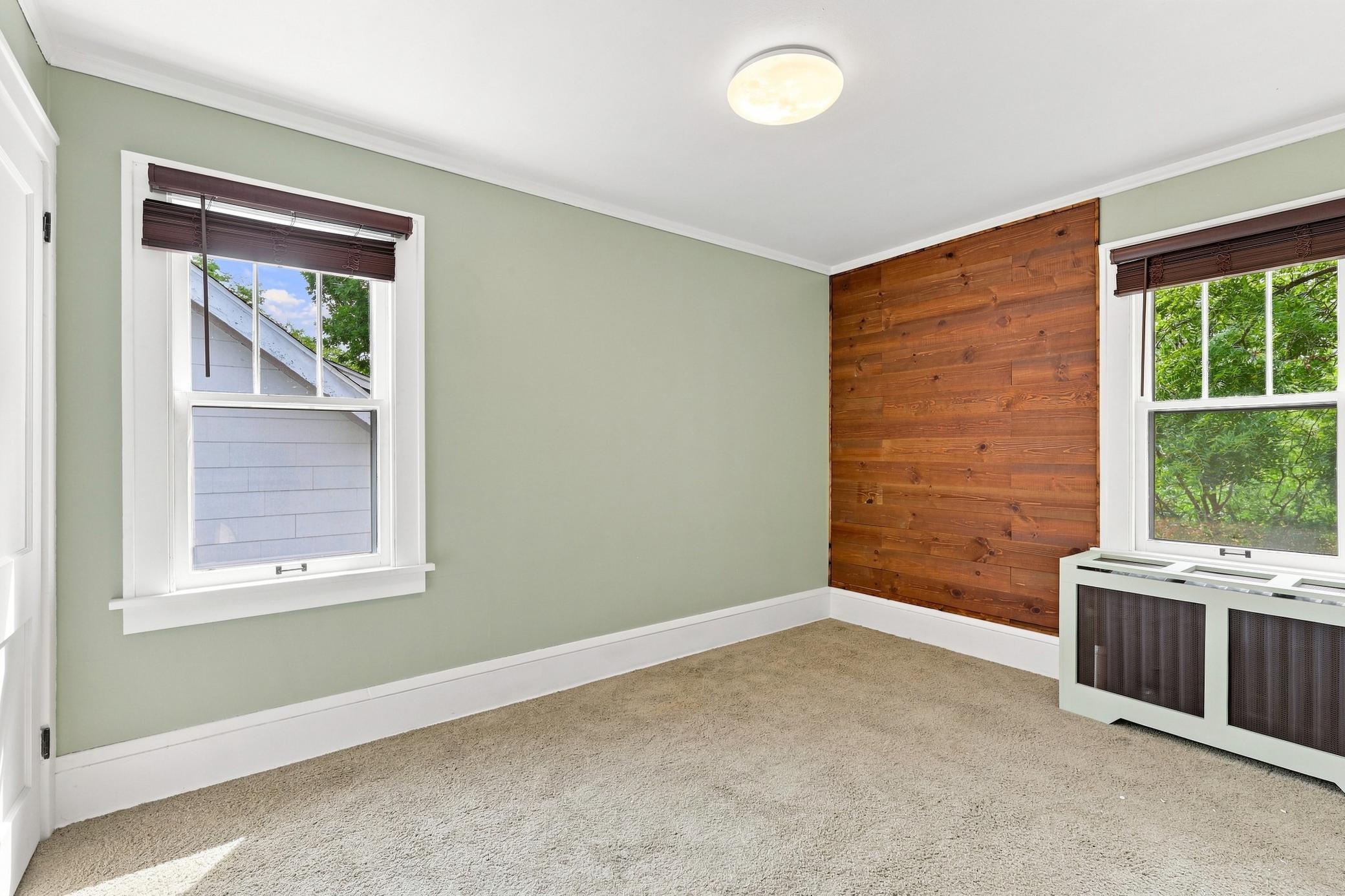 Hardwood under carpet in second bedroom