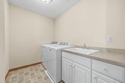Upper level laundry, sink, counter and cabinet space available.