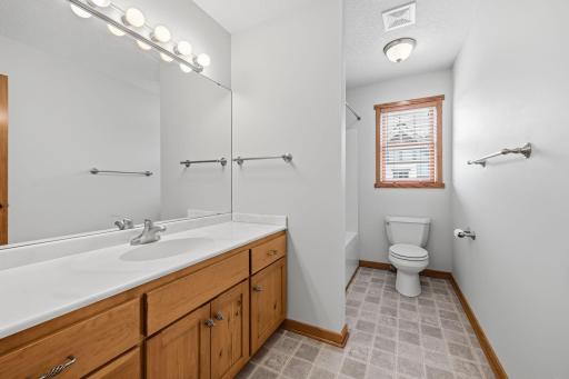 Upper level shared full bath.