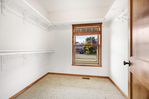 Primary bedroom walk-in closet and shelf space.