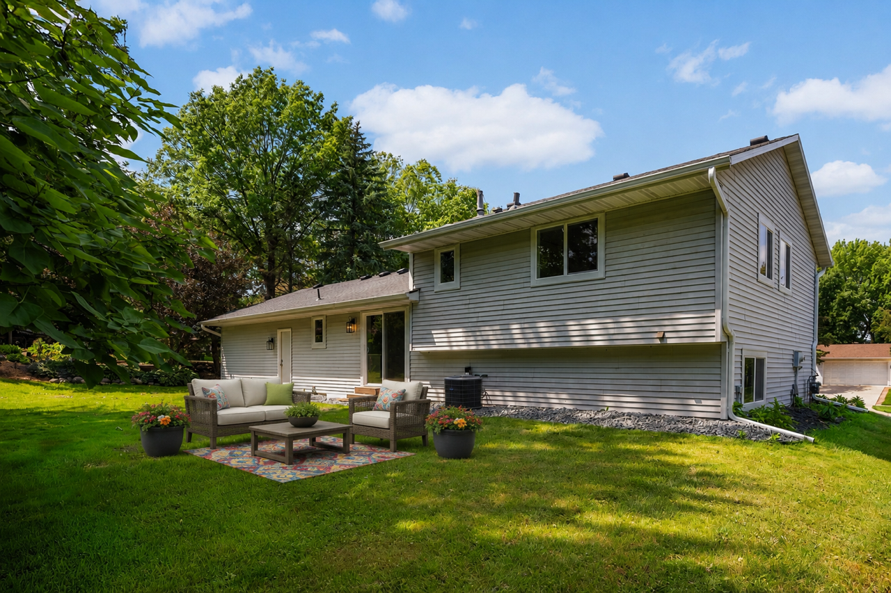 The backyard offers a nice private space for relaxing. Virtually staged.