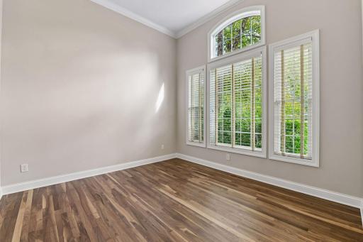 A versatile main-level flex space adds another comfortable retreat for reading, conversation, music, or everyday relaxation.
