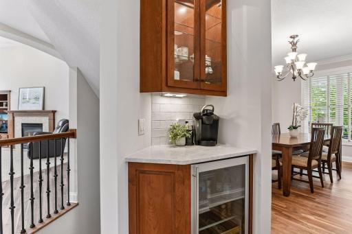 Conveniently positioned between kitchen and dining spaces, the butler area offers additional cabinetry and a beverage refrigerator for effortless entertaining.