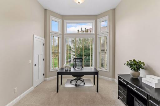 A private main-level office just off the foyer provides a quiet, dedicated space for work, study, or planning.