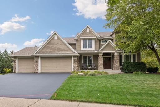 Impressive private setting presents this stunning two-story with nearly 5300 finished set on impressive private setting.