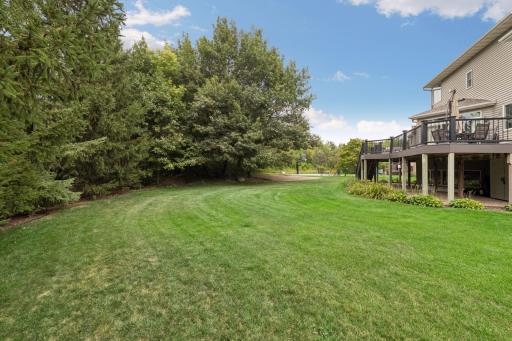 Mature trees surround the property, creating a private, peaceful setting with room to relax, play, and enjoy the outdoors.