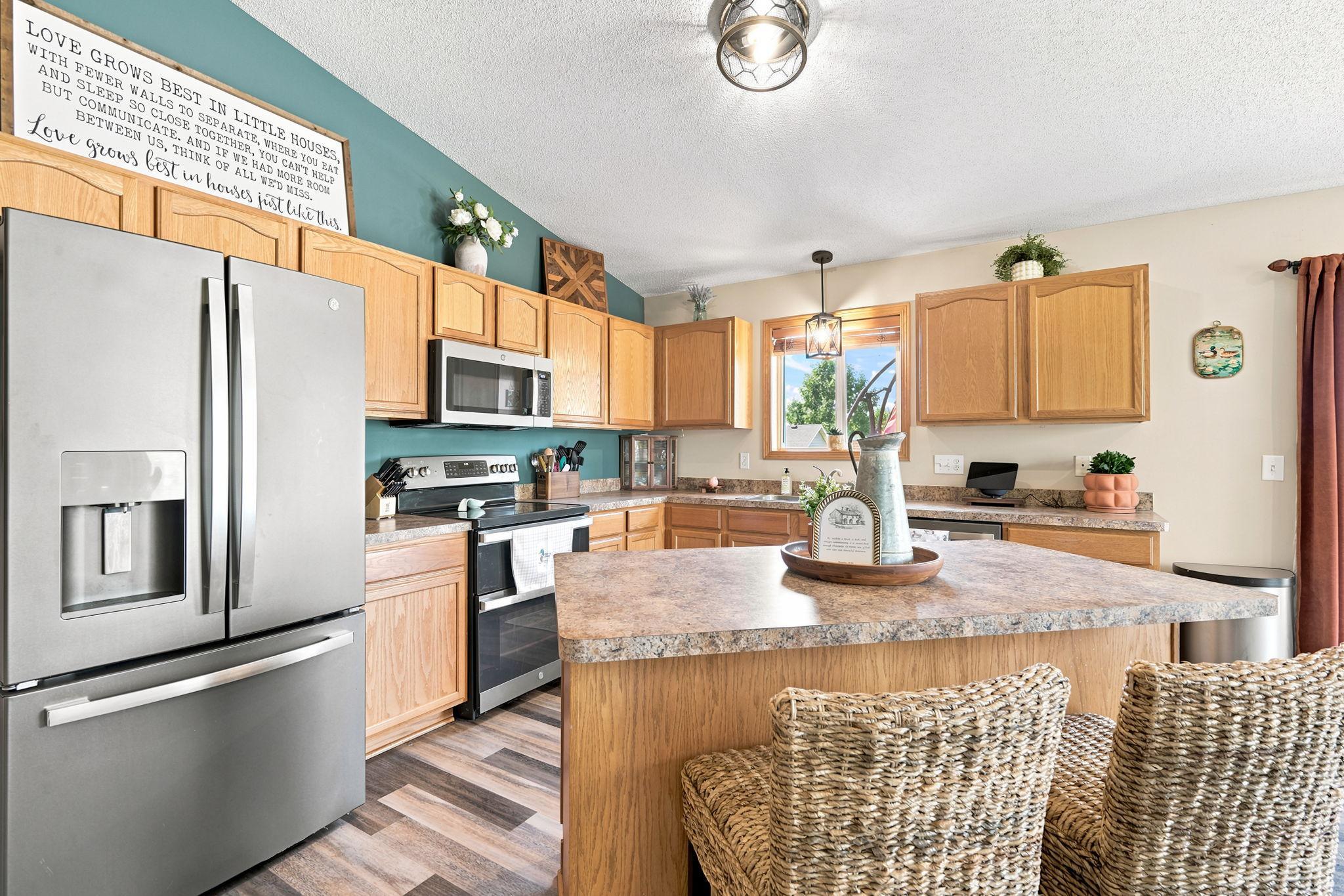Updated Kitchen Features Granite Countertops and Stainless Steel Appliances