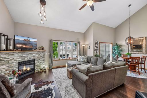 Welcome to 912 Kelly Court in Chanhassen. Open floor plan for easy entertaining, beautiful hardwood floors, new lighting and stone surround the gas fireplace.