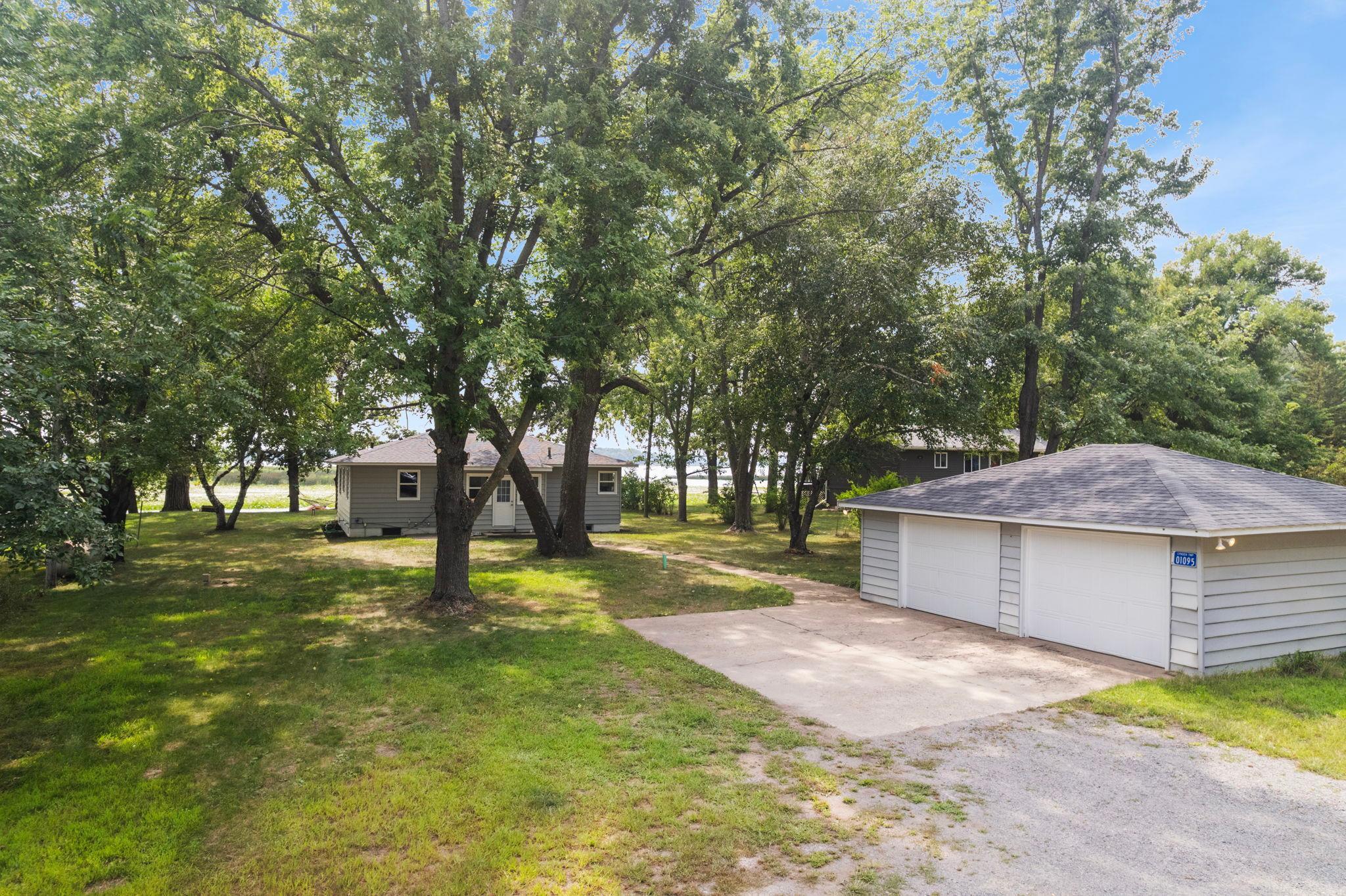 Detached garage with parking pad