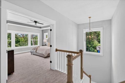 The large window baths the stairwell in natural light.
