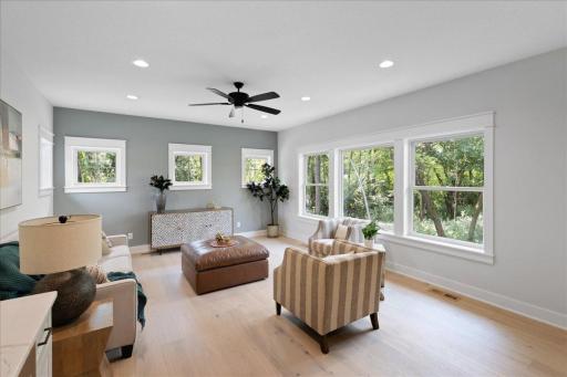 Upper level Rec Room is the perfect space to watch the big game or snuggle up for movie night with family. It features a wet bar area and 1/2 bathroom.