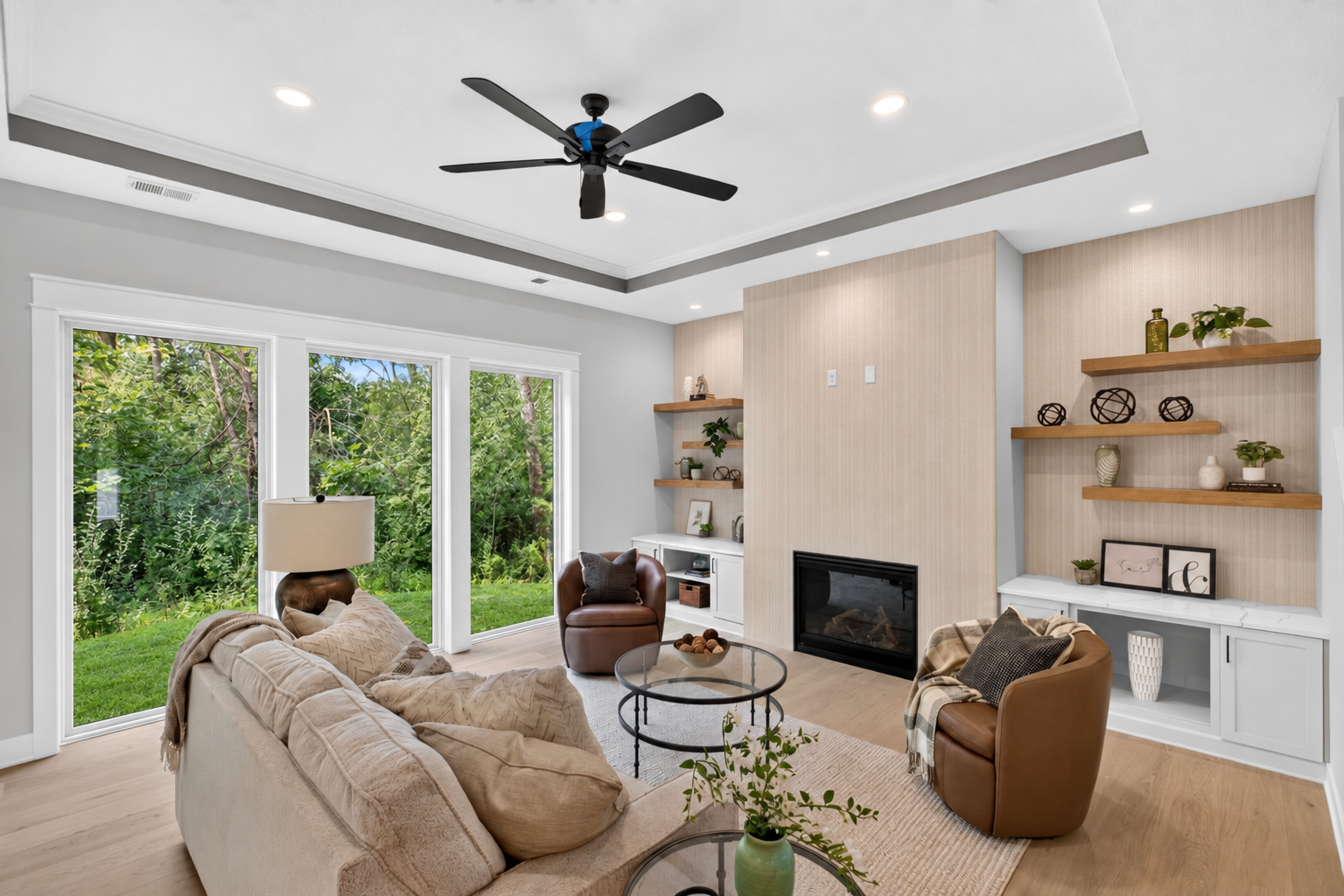 The massive windows flood the main level with natural light and offer stunning views of the surrounding woods all year round!