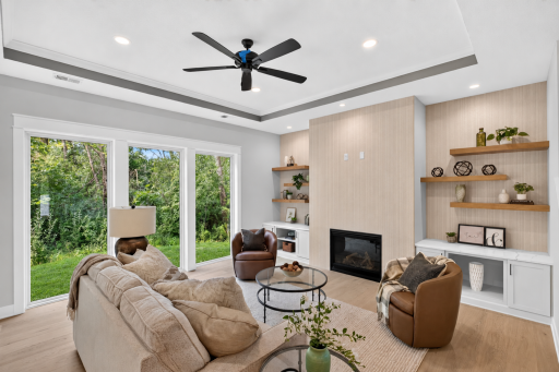 The massive windows flood the main level with natural light and offer stunning views of the surrounding woods all year round!