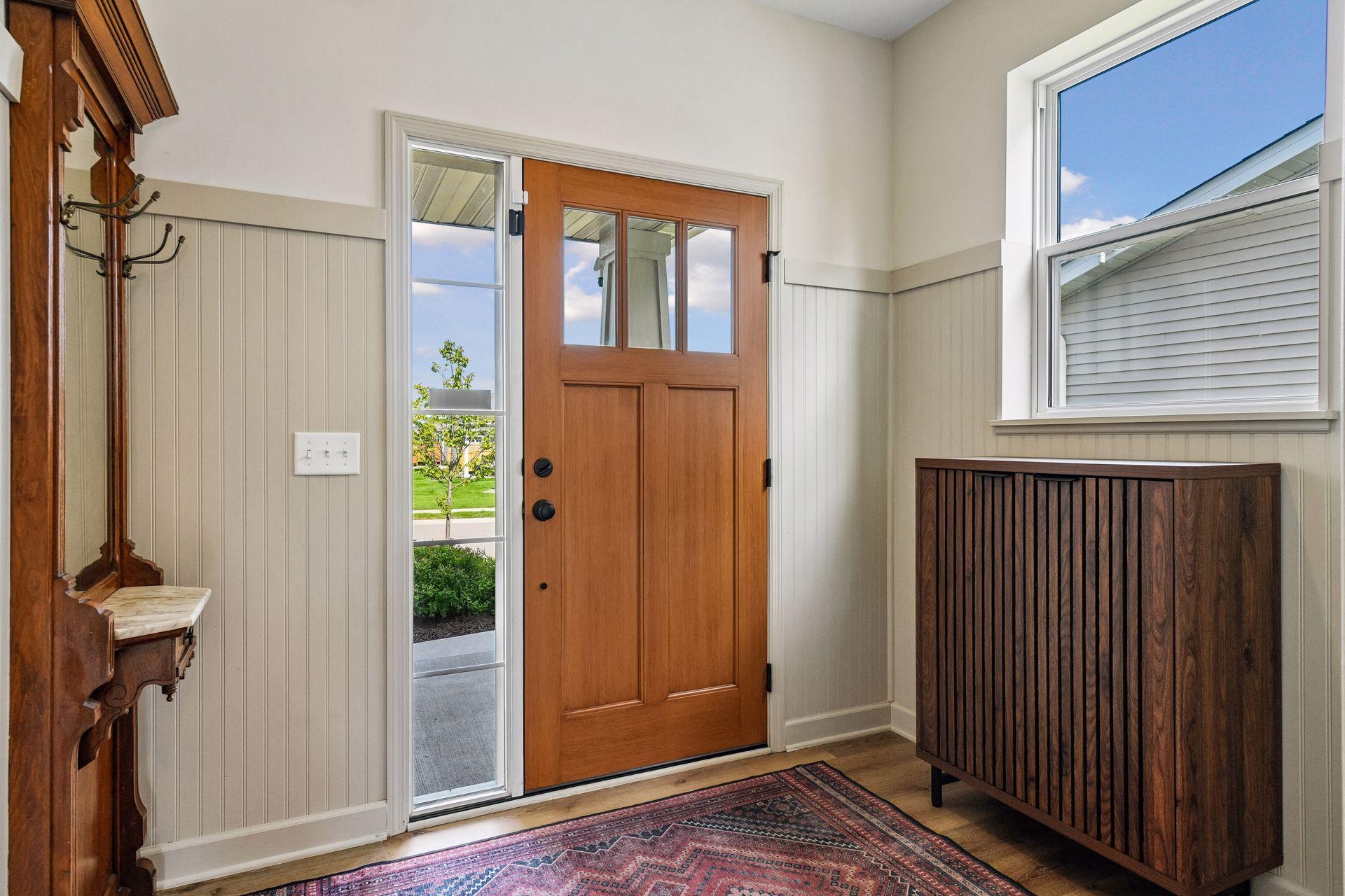 Front entry way complete with wood door and breadboard surround