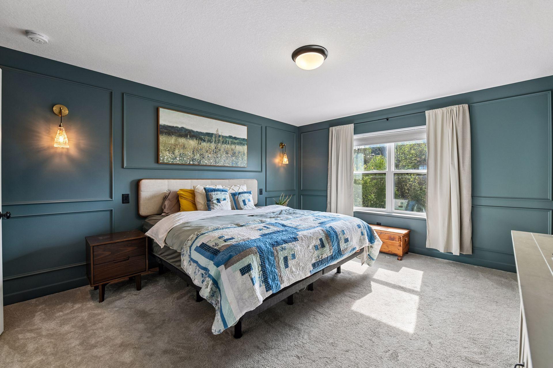 Primary bedroom overlooking private backyard