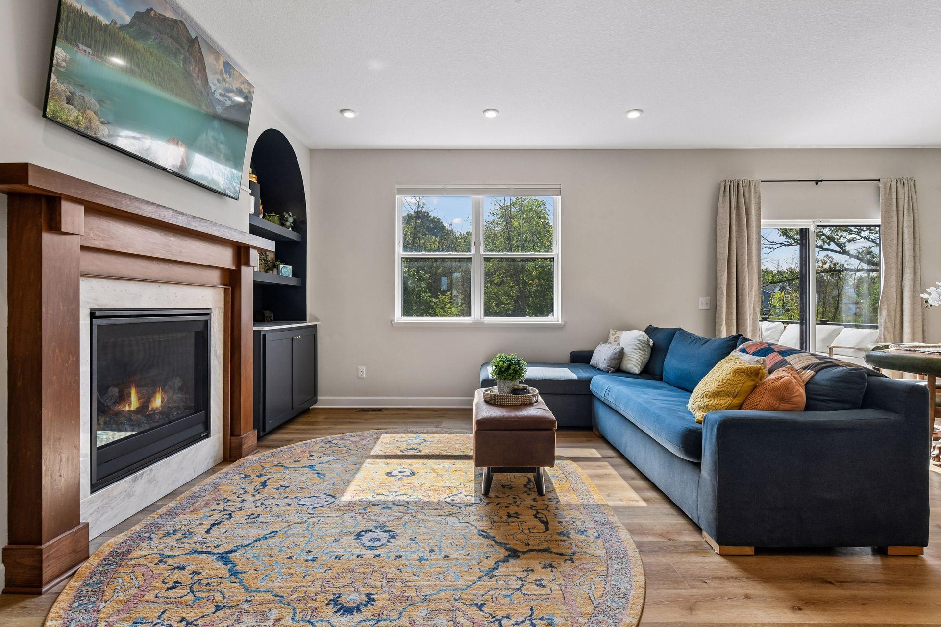 Living room seating area facing fireplace wall